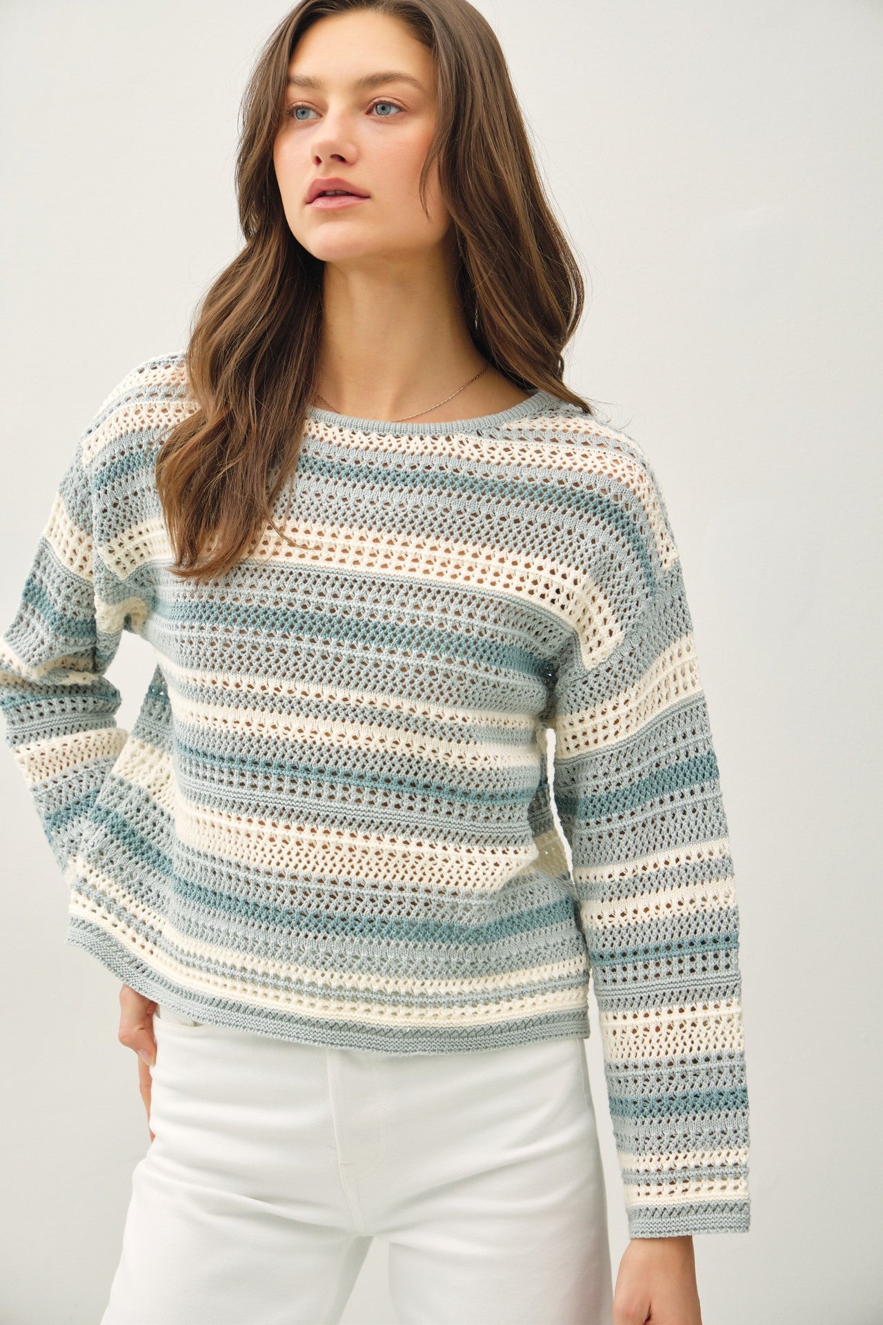 Women's Striped Blue Crochet Sweater
Cozy up in this effortlessly stylish blue striped crochet sweater